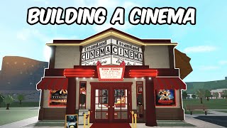 Building a MOVIE THEATRE in my BLOXBURG TOWN [upl. by Hanaj845]